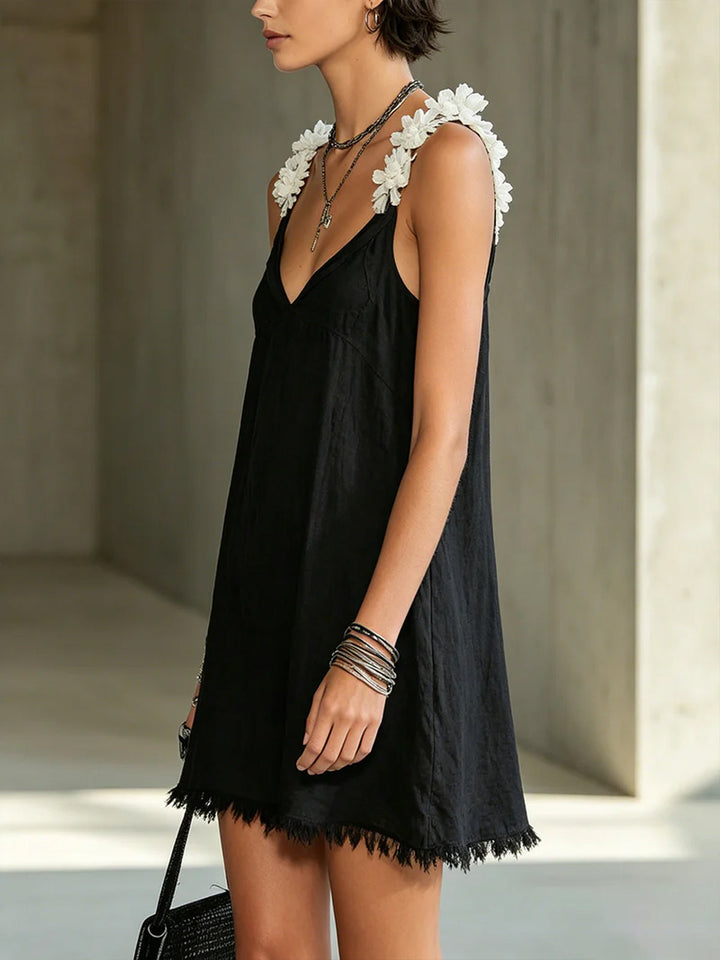 Black mini dress with V-neck and floral straps